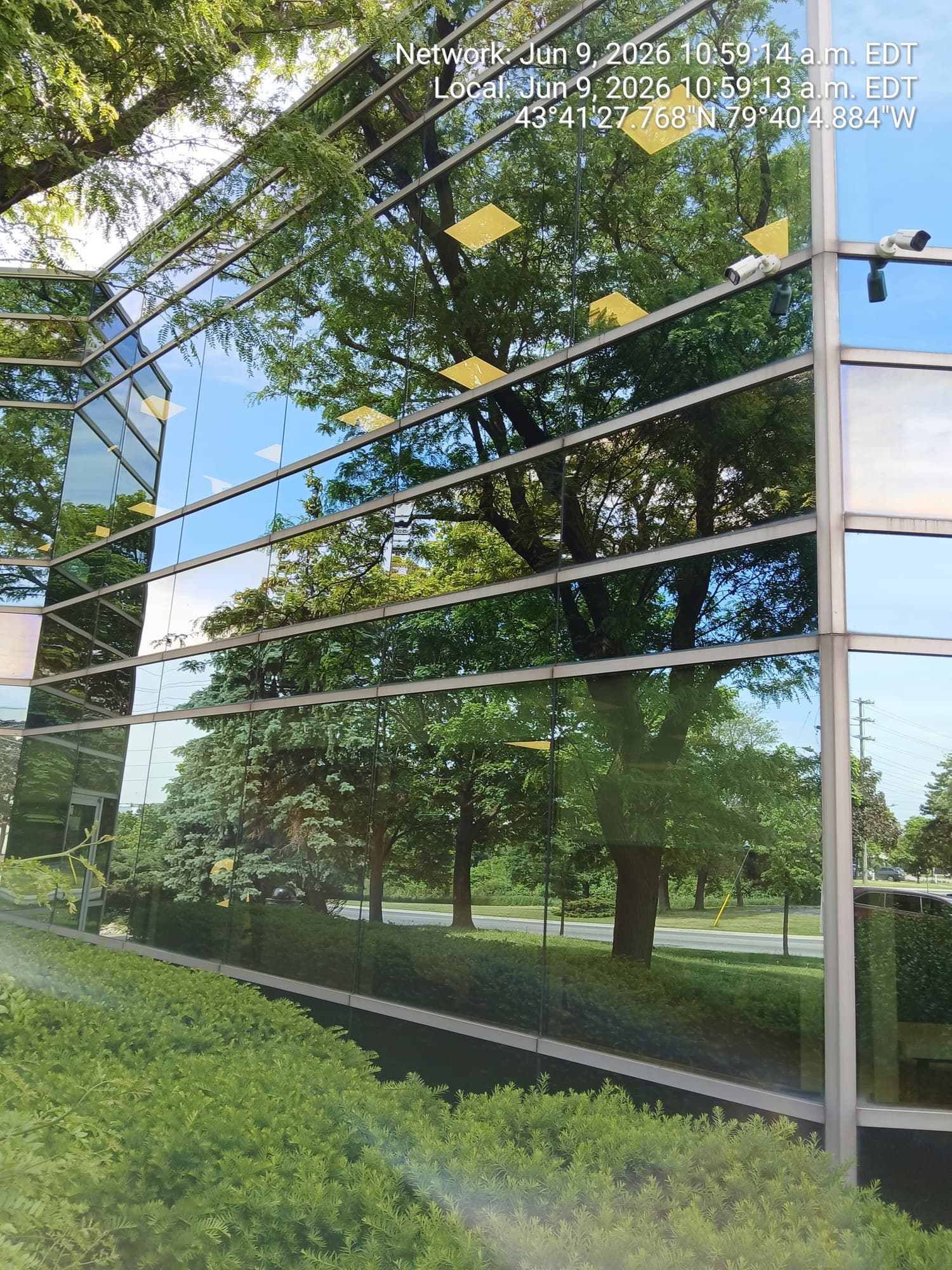 Reflective office building glass cleaned to a mirror shine